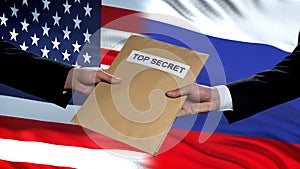 USA and Russia politicians exchanging top secret envelopes, flags background