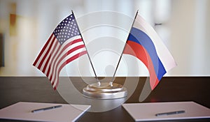 USA and Russian flags on table. Negotiation between Russia and United states. 3D rendered illustration.