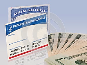 USA social security card with medicare and US dollars to illustrate budget crisis