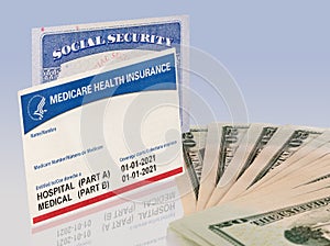 USA social security card with medicare and US dollars to illustrate budget crisis photo