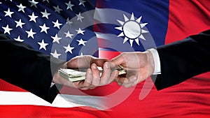 USA and Taiwan officials exchanging money against flag international cooperation