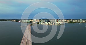 USA travel destination. Aerial view of Sarasota city downtown with Ringling Bridge and high-rise office buildings on