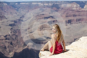 USA traveling. Woman on american grand canyon. Young female enjoying view of national park. Travel and adventure concept