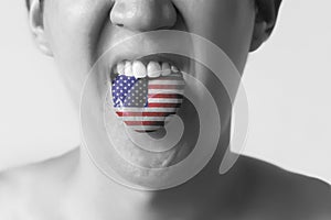 USA or United States flag painted in tongue of a man - indicating English language and American accent speaking, study in