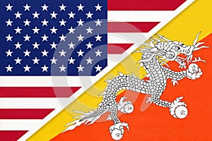 USA vs Kingdom of Bhutan national flag from textile. Relationship between two american and asian countries