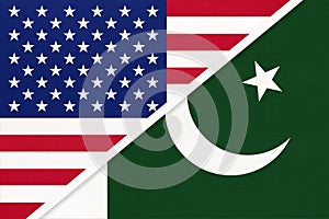USA vs Pakistan national flag from textile. Relationship between two american and asian countries photo