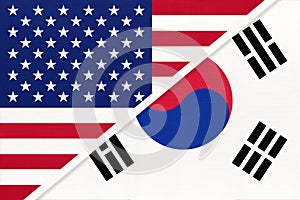 USA vs South Korea national flag from textile. Relationship between two american and asian countries