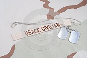 USACE CIVILAN branch tape with dog tags on desert camouflage uniform