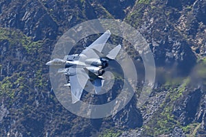 USAF F-15E Strike Eagle flying through the Mach Loop