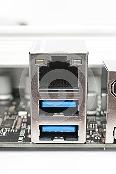 Usb 2.0 type-a and LAN ports on a computer motherboard on white background