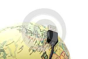 USB Cables with globe world map,connected to the globe Concept.