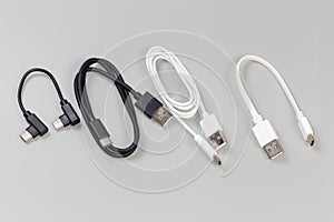 USB cables Type-A and Type-C on gray background