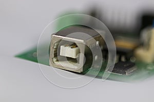USB connector on green PCB.