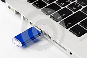 USB Flash drive on computer laptop keyboard