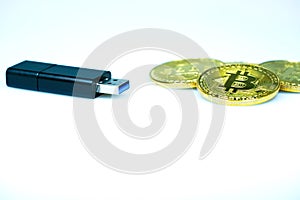 USB flash drive and golden bitcoin