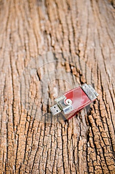 Usb flash drive on wooden texture background