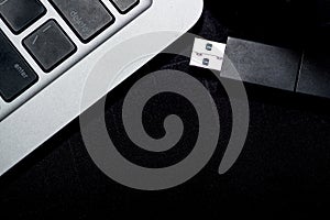 USB flash memory drive plugged into a computer laptop port.