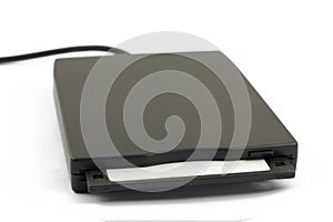 USB floppy drive with disk on white