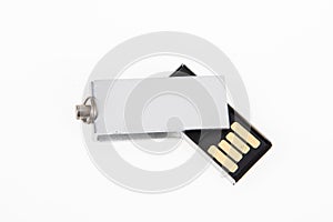 USB Key silver Flash Drive rotating Stick Memory on white desk background