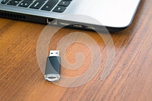 USB memory stick or flash drive and laptop computer