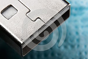 Usb plug close-up on blue background