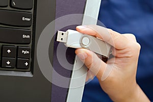 USB stick or USB thumb drive with virus plug in to laptop computer port