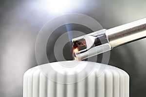 Tesla lighter ignites candle wick