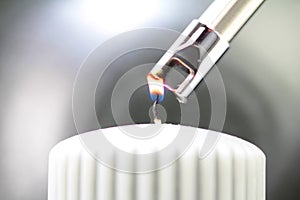 Tesla lighter ignites candle wick