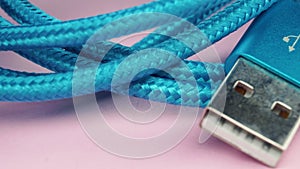 Usb type c cable panning on pink backround.