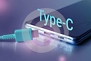 USB Type C Port Cable and the word Type-C on the smartphone screen. Close-up, Copy space