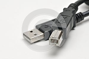 USB A and USB B printer plug cable on white background