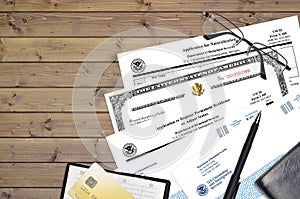 USCIS form I-485 Application to register permanent residence or adjust status and N-400 Application for naturalization with