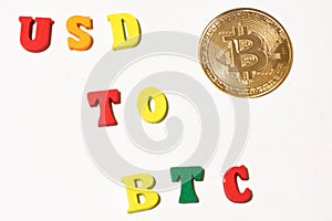 Usd to btc exchange concept with bitcoin cryptocurrency coin. Concept with letterboard