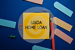 USDA Home Loan write on sticky note isolated on Office Desk