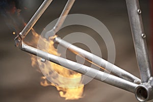 Use of a the fire of a blowtorch to remove the paint of a bicycle frame