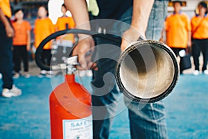 Use a fire extinguisher to fire at the gas tank.