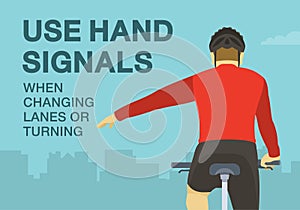 Use hand signals when changing lanes or turning. Close-up back view of a cyclist showing left turn gesture while cycling.