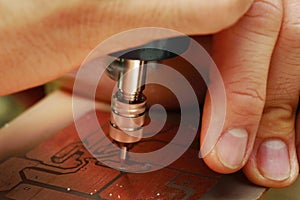 Use mini drill to broach on Printed Circuit Boards.