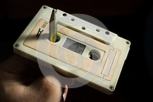 Use pencil to spinning cassette tape.