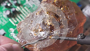 Use rosin for soldering. Melt the tin with a heated soldering iron.