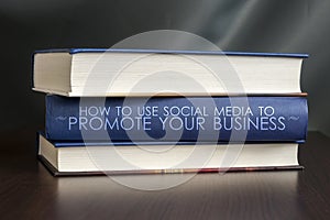 Use social media to promote your business. Book concept. photo