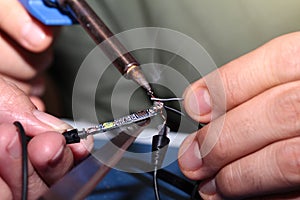 Use Soldering Iron to weld connection pore with Tin Wire.