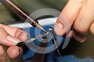 Use Soldering Iron to weld connection pore with Tin Wire.