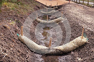 The use of straw wattles. Land drainage works photo