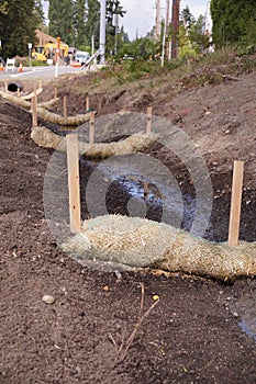 The use of straw wattles straw worms, bio-logs, straw noodles. Land drainage works photo