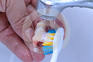 Use a toothbrush to clean teeth partial denture