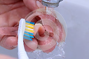 Use a toothbrush to clean teeth partial denture