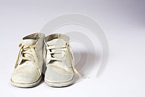 Used Baby Shoes on White Background