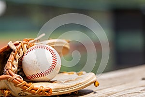 Used Baseball in glove for sports background with copy space