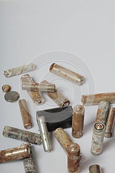 Used batteries on a white background. Recycling waste batteries. Environmental Protection. Earth Day
